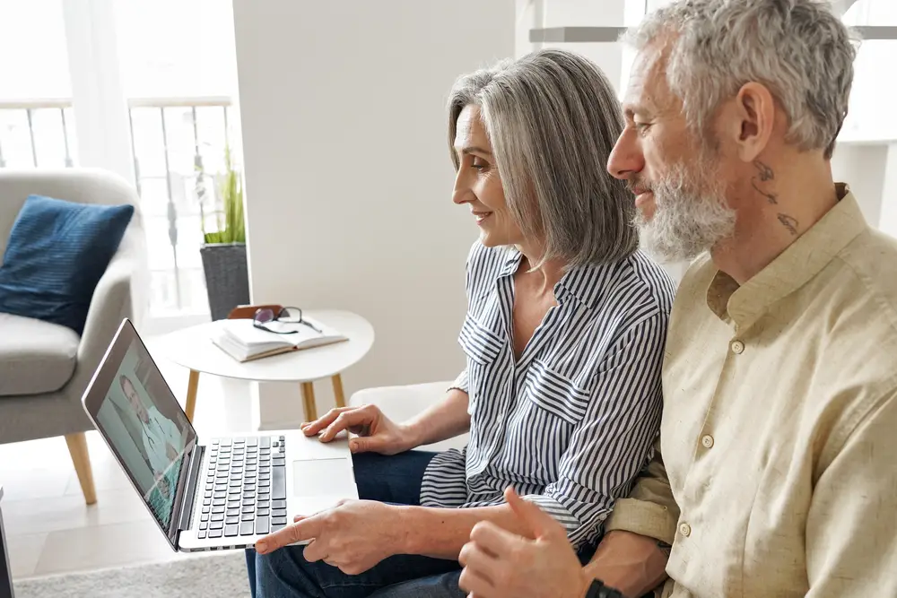 Senior mature family couple getting online telemedicine call consultation